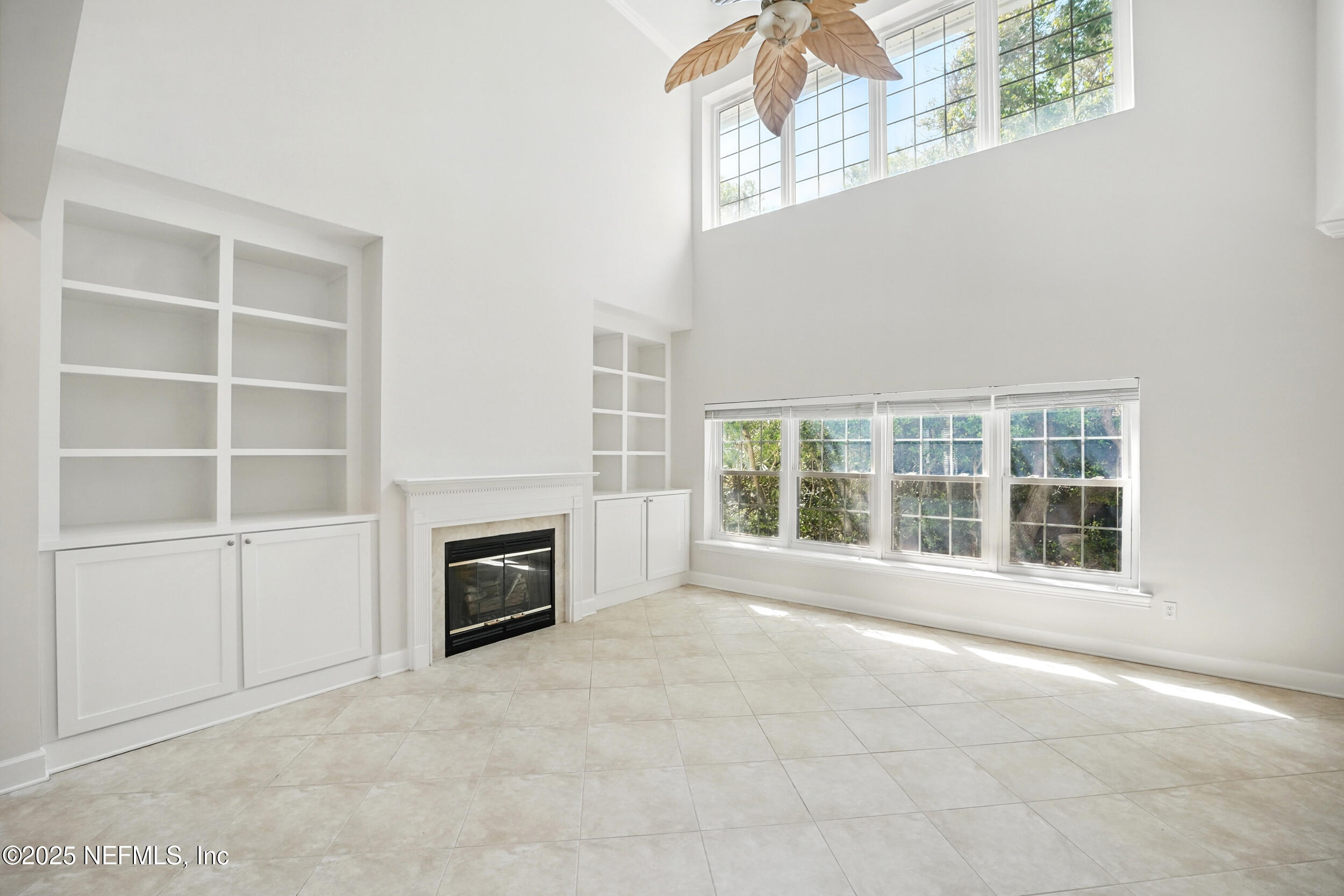 105 2nd Street St. Augustine, FL 32084 - Photo 15 of 61 a view of an empty room with a fireplace and a window