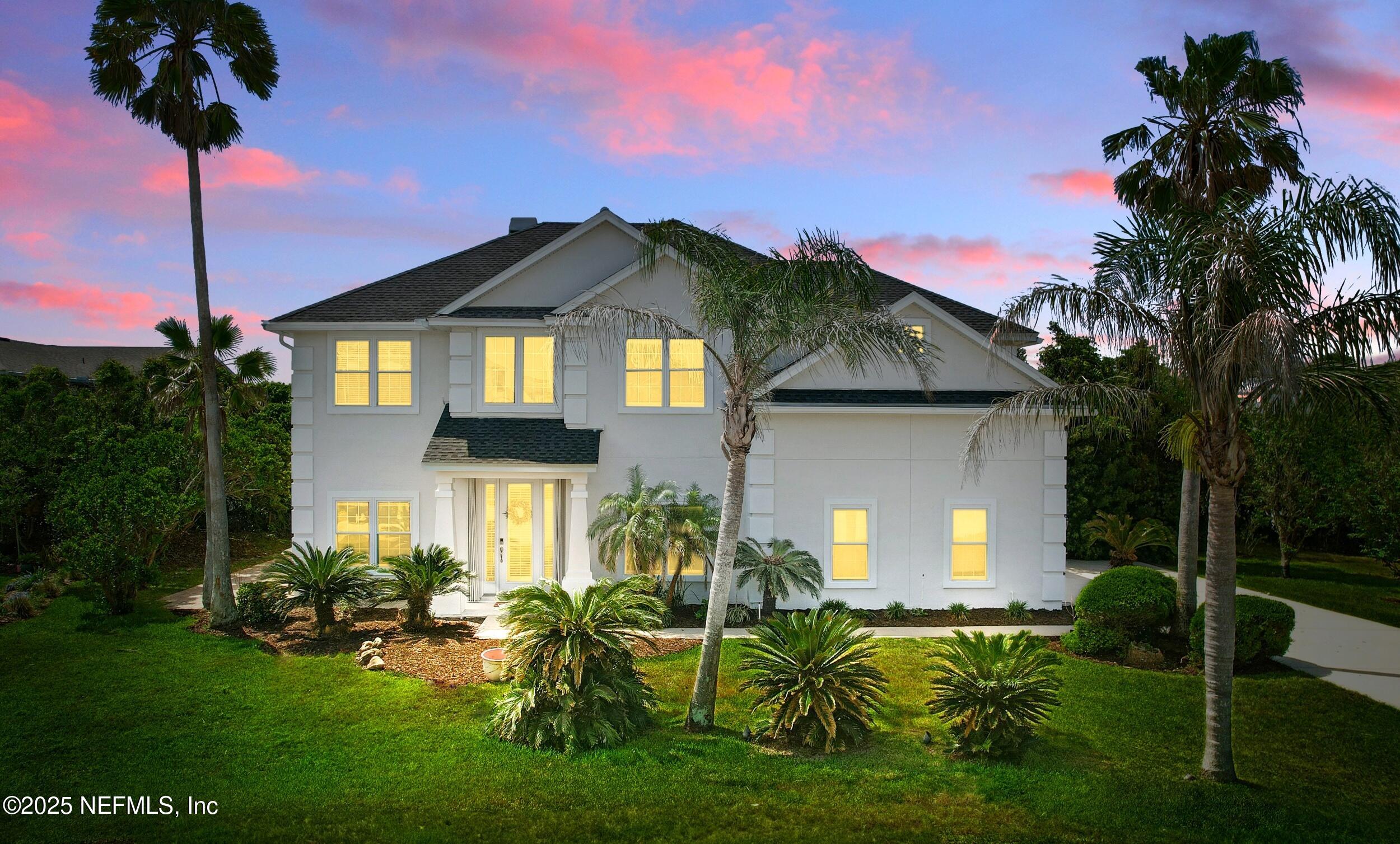 105 2nd Street St. Augustine, FL 32084 - Photo 2 of 61 a front view of a house with a garden