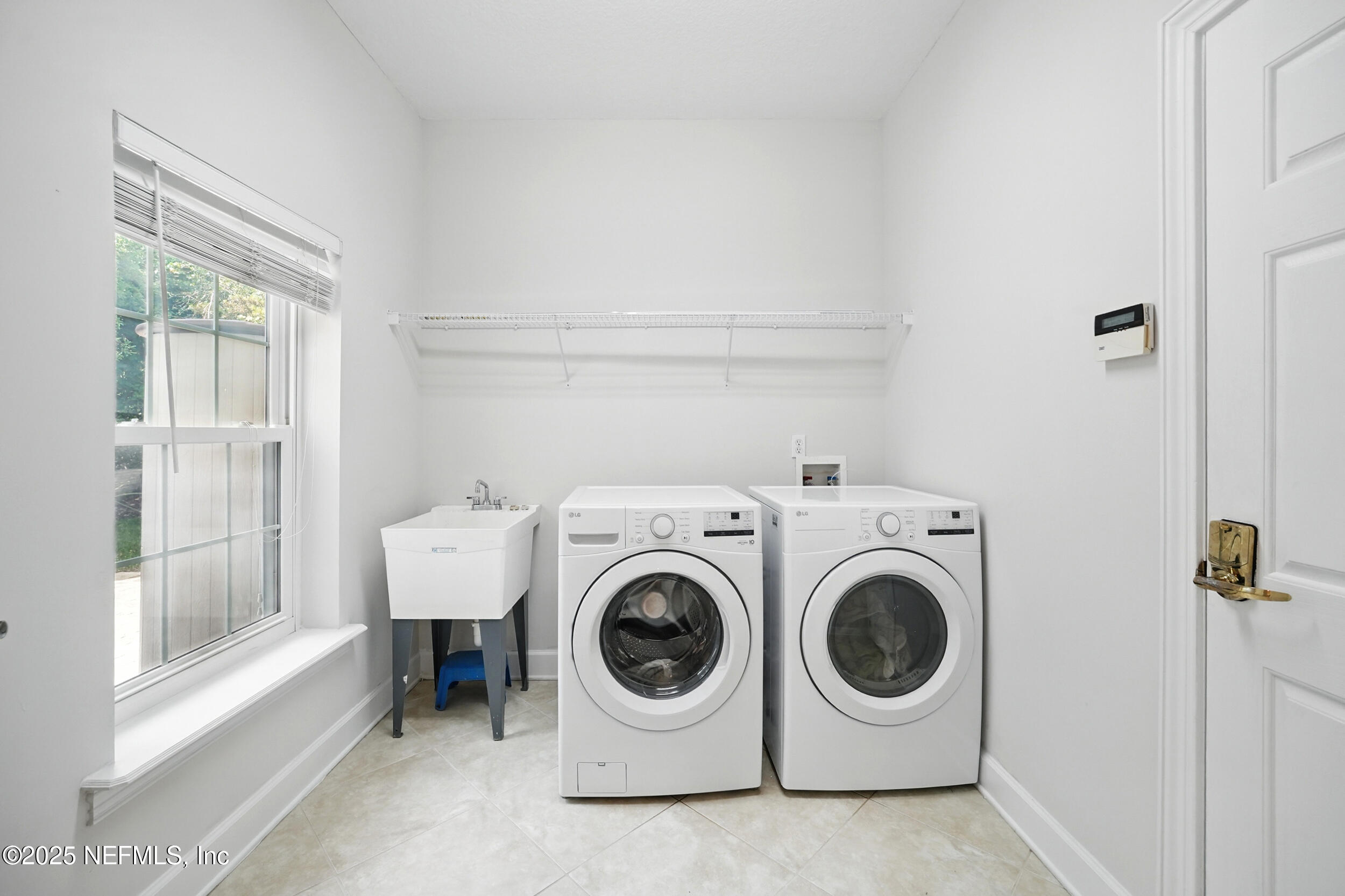 105 2nd Street St. Augustine, FL 32084 - Photo 22 of 61 a utility room with dryer and washer