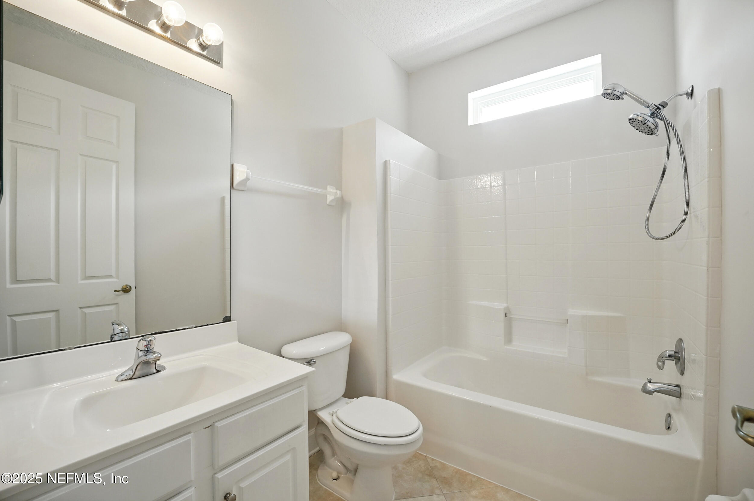 105 2nd Street St. Augustine, FL 32084 - Photo 25 of 61 a bathroom with a sink toilet and shower