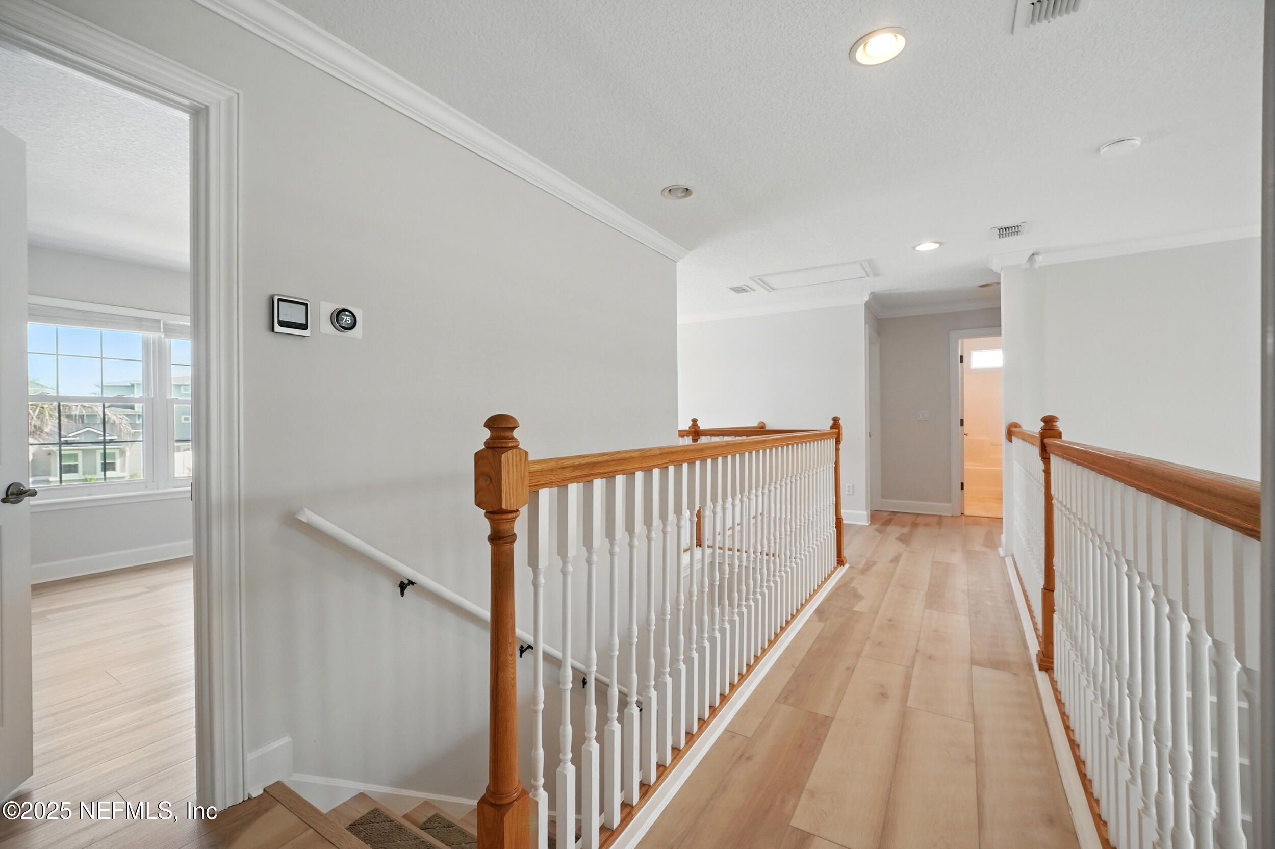 105 2nd Street St. Augustine, FL 32084 - Photo 27 of 61 a view of a hallway with wooden floor and staircase