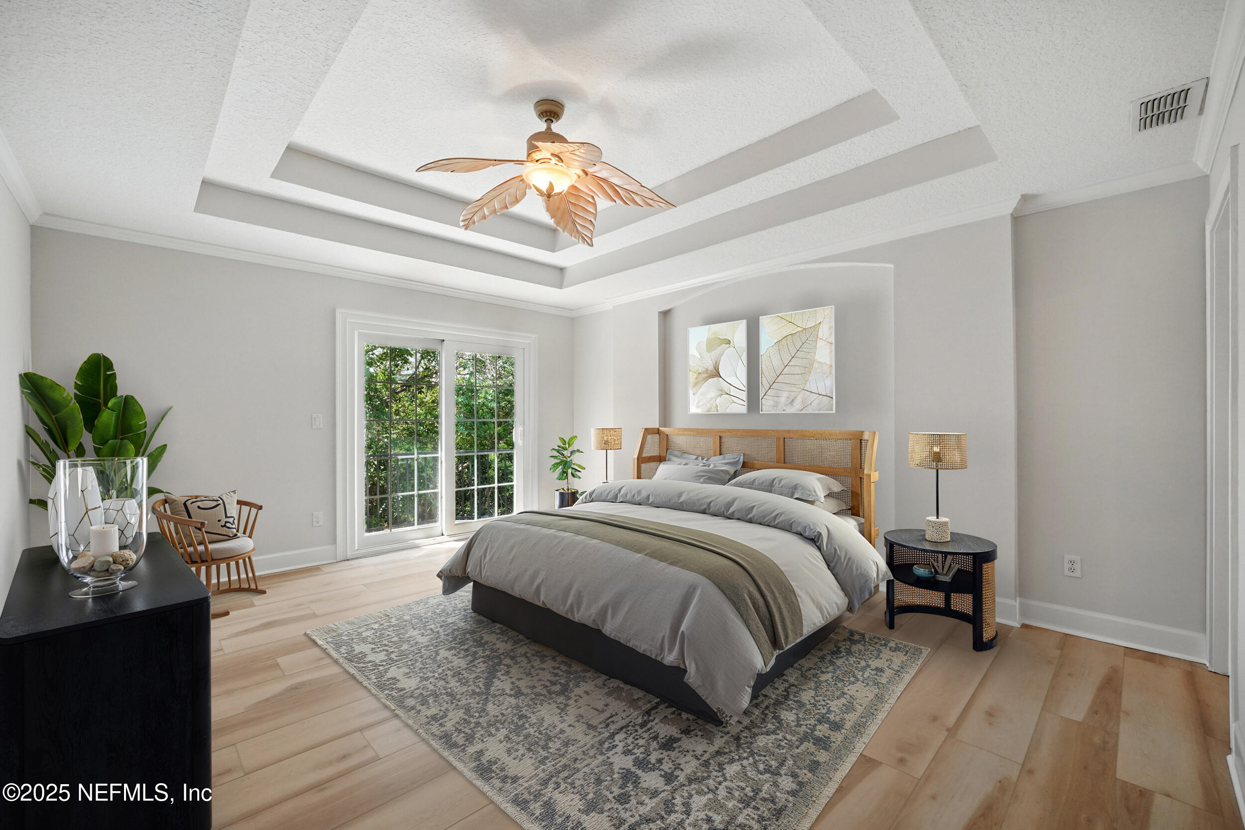 105 2nd Street St. Augustine, FL 32084 - Photo 29 of 61 a bedroom with a large bed and a chandelier