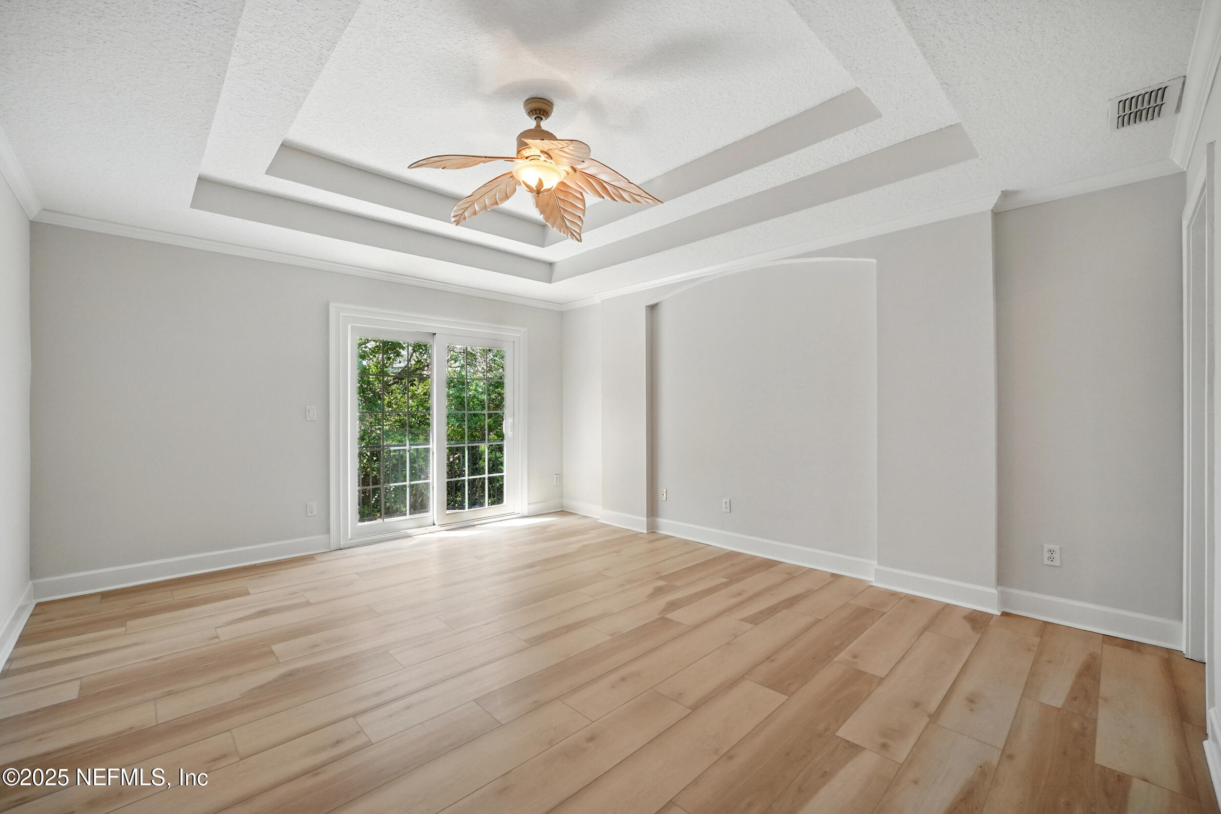 105 2nd Street St. Augustine, FL 32084 - Photo 30 of 61 a view of an empty room with wooden floor and a ceiling fan