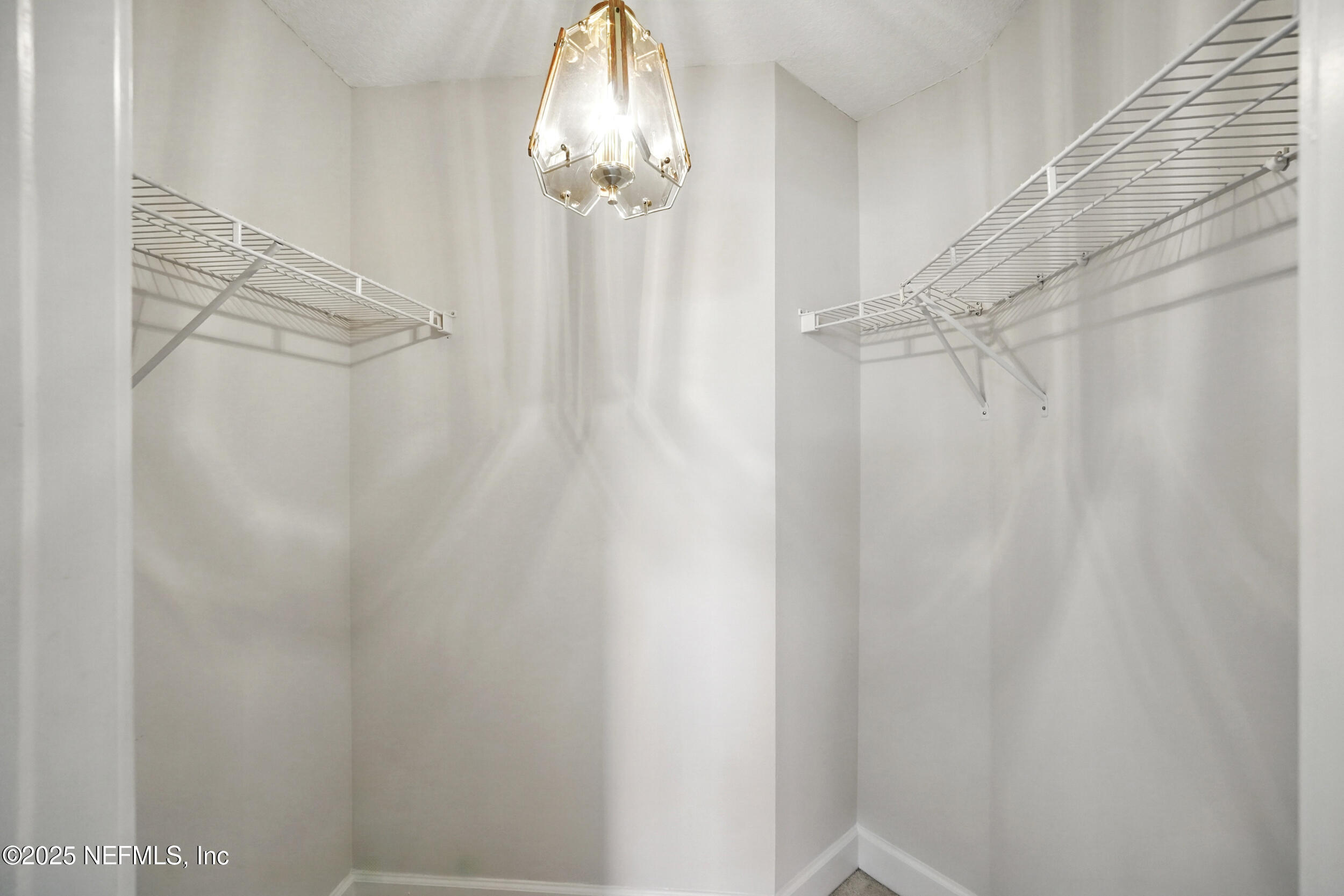 105 2nd Street St. Augustine, FL 32084 - Photo 36 of 61 a bathroom with a shower curtain and a sink