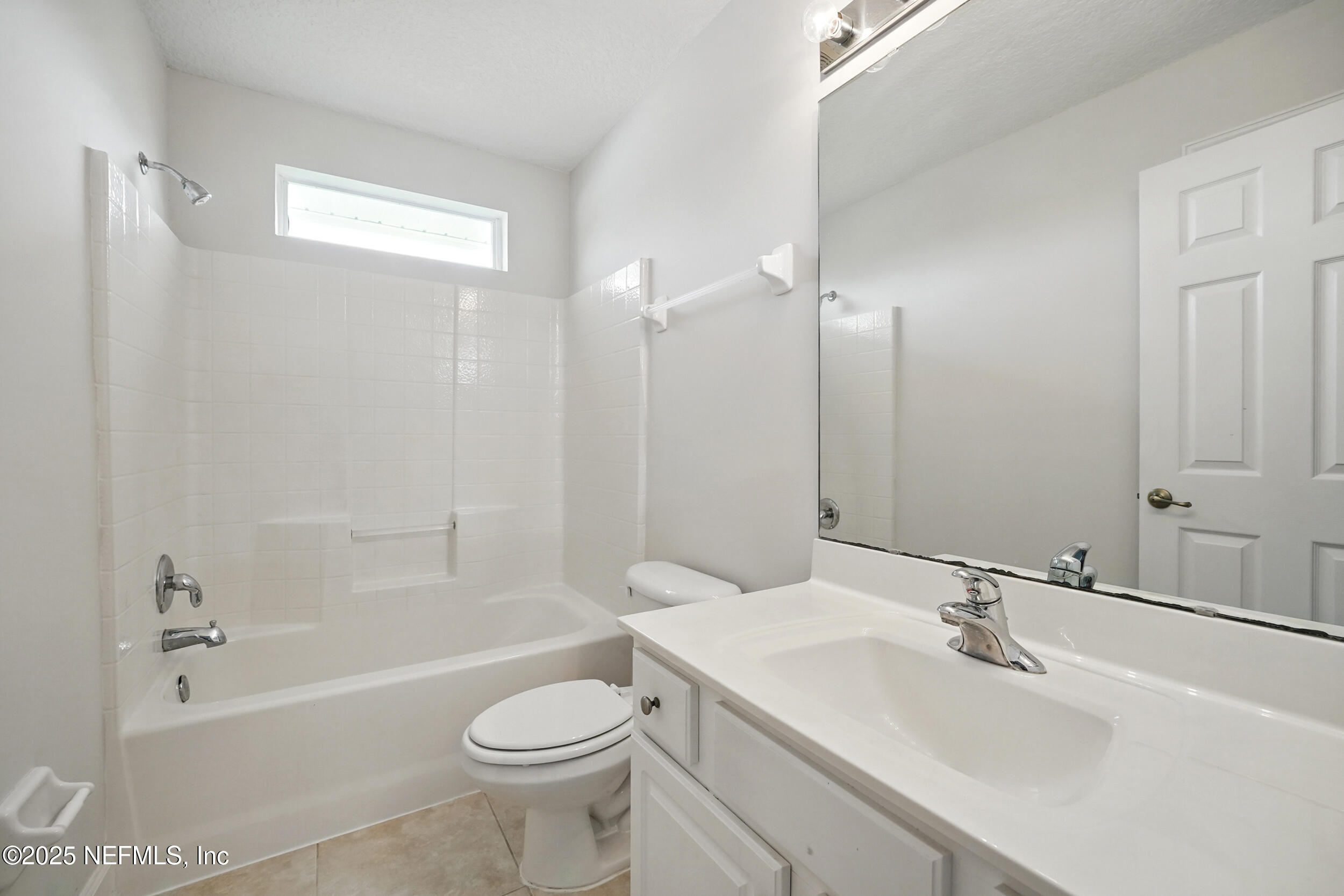105 2nd Street St. Augustine, FL 32084 - Photo 45 of 61 a bathroom with a sink a toilet and shower