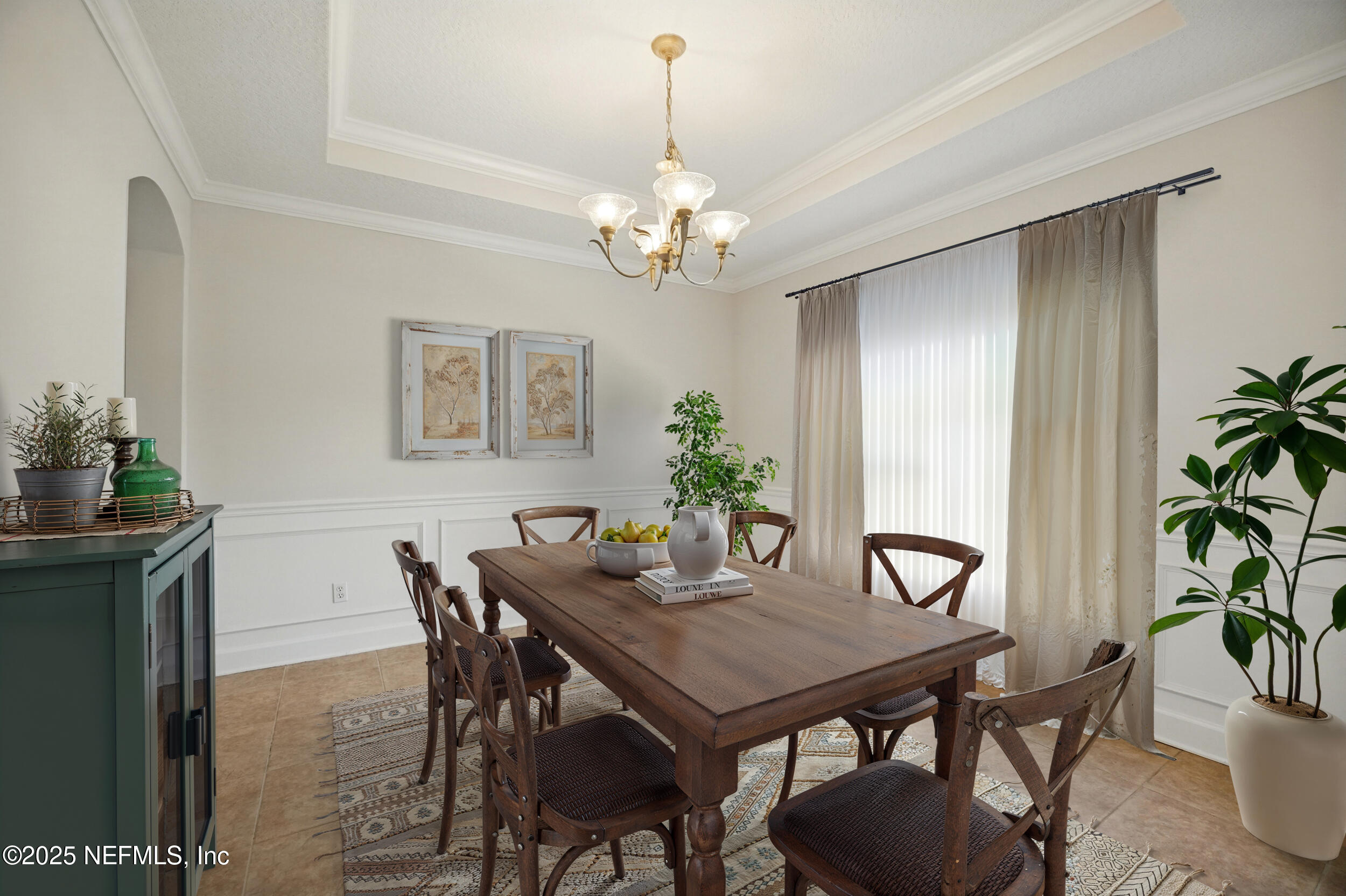 105 2nd Street St. Augustine, FL 32084 - Photo 7 of 61 a view of a dining room with furniture and chandelier
