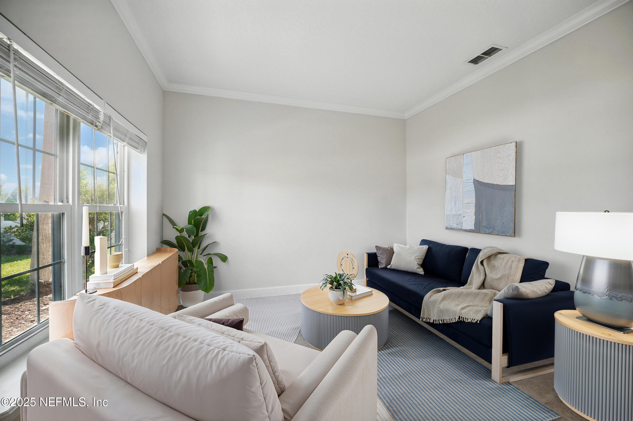 105 2nd Street St. Augustine, FL 32084 - Photo 10 of 61 a living room with furniture and a potted plant