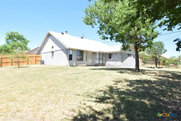 a view of house with swimming pool