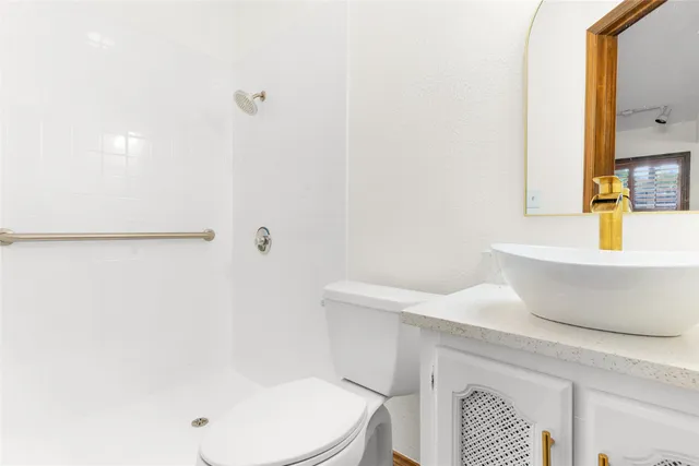 a living room with furniture a dining table and chairs