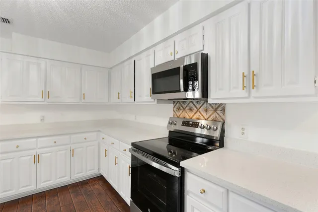 a kitchen with a sink and a window