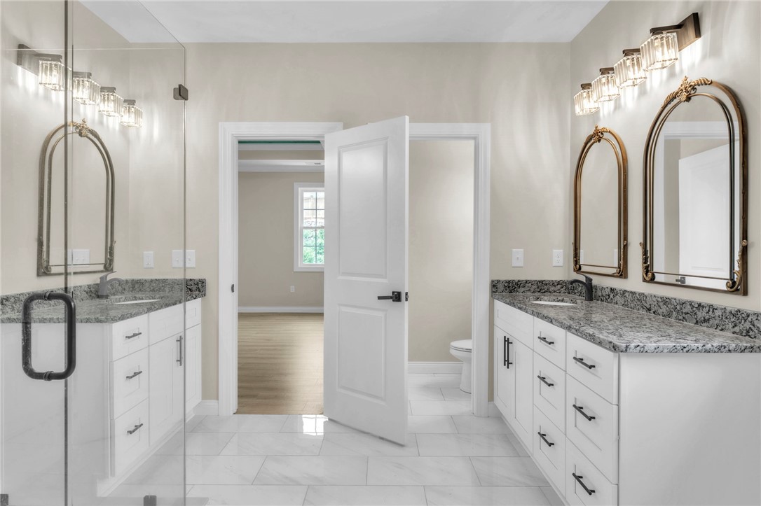 1015 Winmar Drive Anderson, SC 29621 - Photo 24 of 49 This spacious bathroom offers elegant dual vanities and bright lighting for a refreshing start to your day.