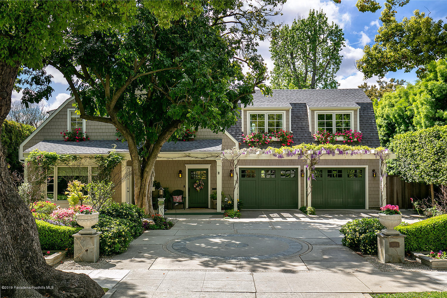 a front view of a house with garden