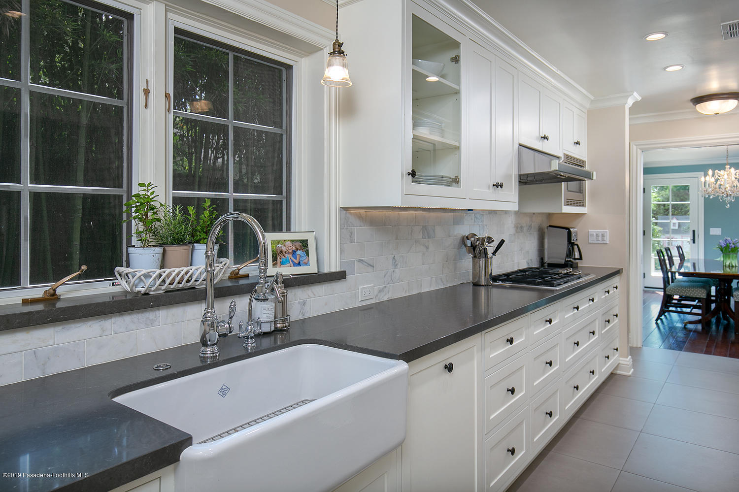 504 Arbor Street Pasadena, CA 91105 - Photo 11 of 46 a kitchen with granite countertop a sink and cabinets