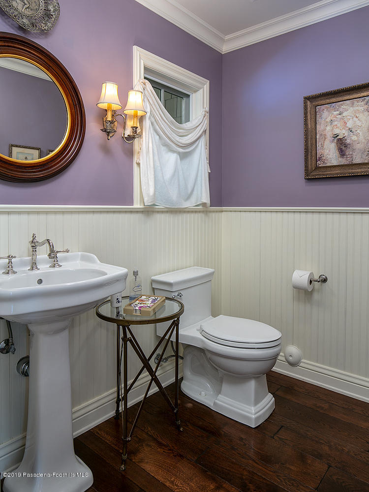 504 Arbor Street Pasadena, CA 91105 - Photo 16 of 46 a bathroom with a toilet a sink and a mirror