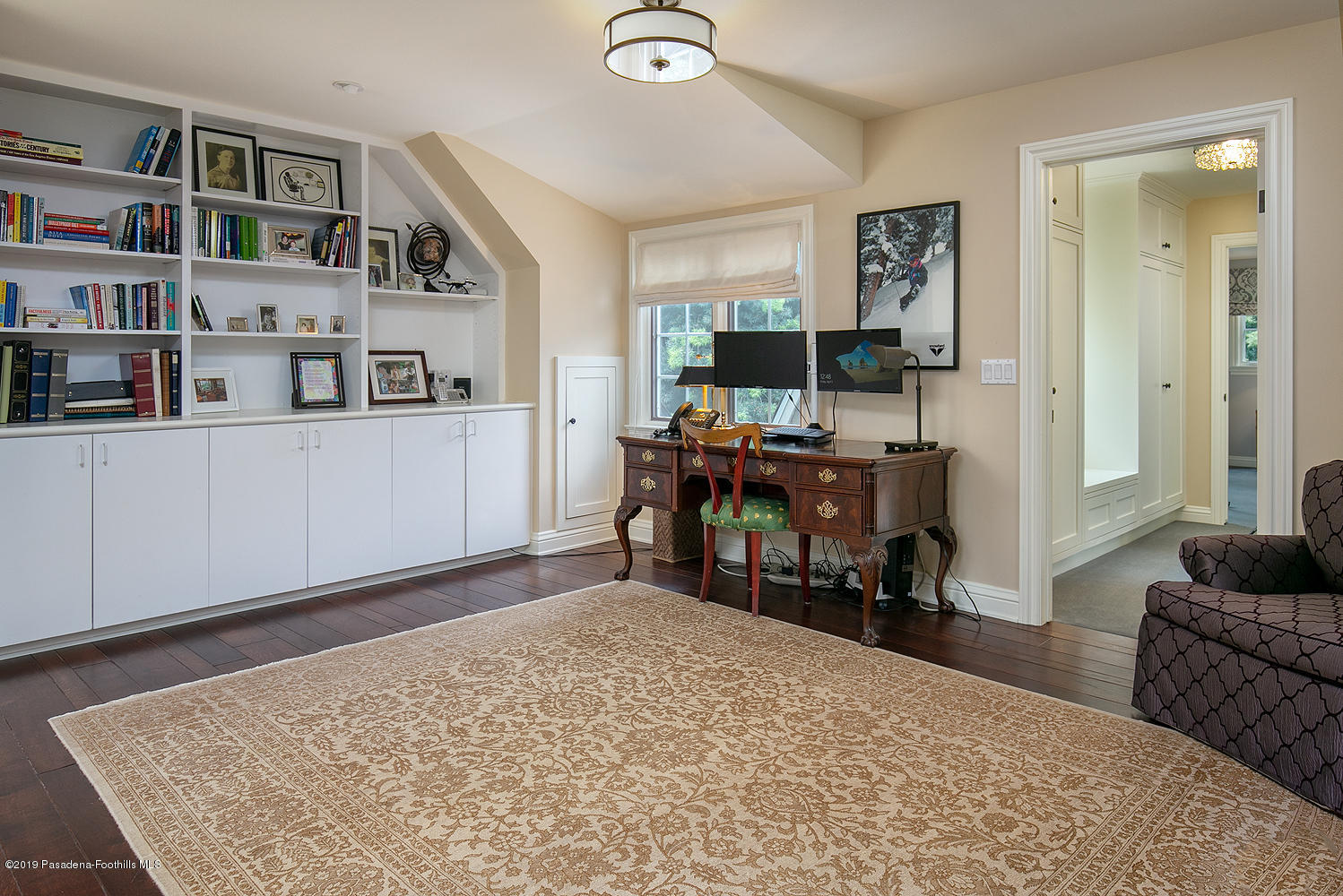 504 Arbor Street Pasadena, CA 91105 - Photo 21 of 46 a bed room with a bed and a book shelf