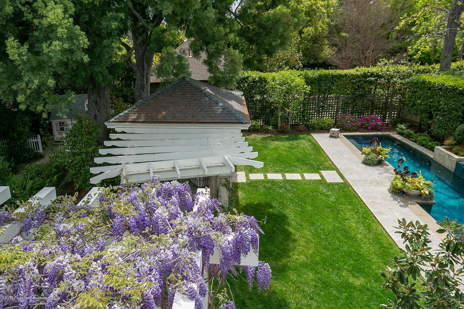 504 Arbor Street Pasadena, CA 91105 - Photo 25 of 46 a view of a house with a yard and potted plants