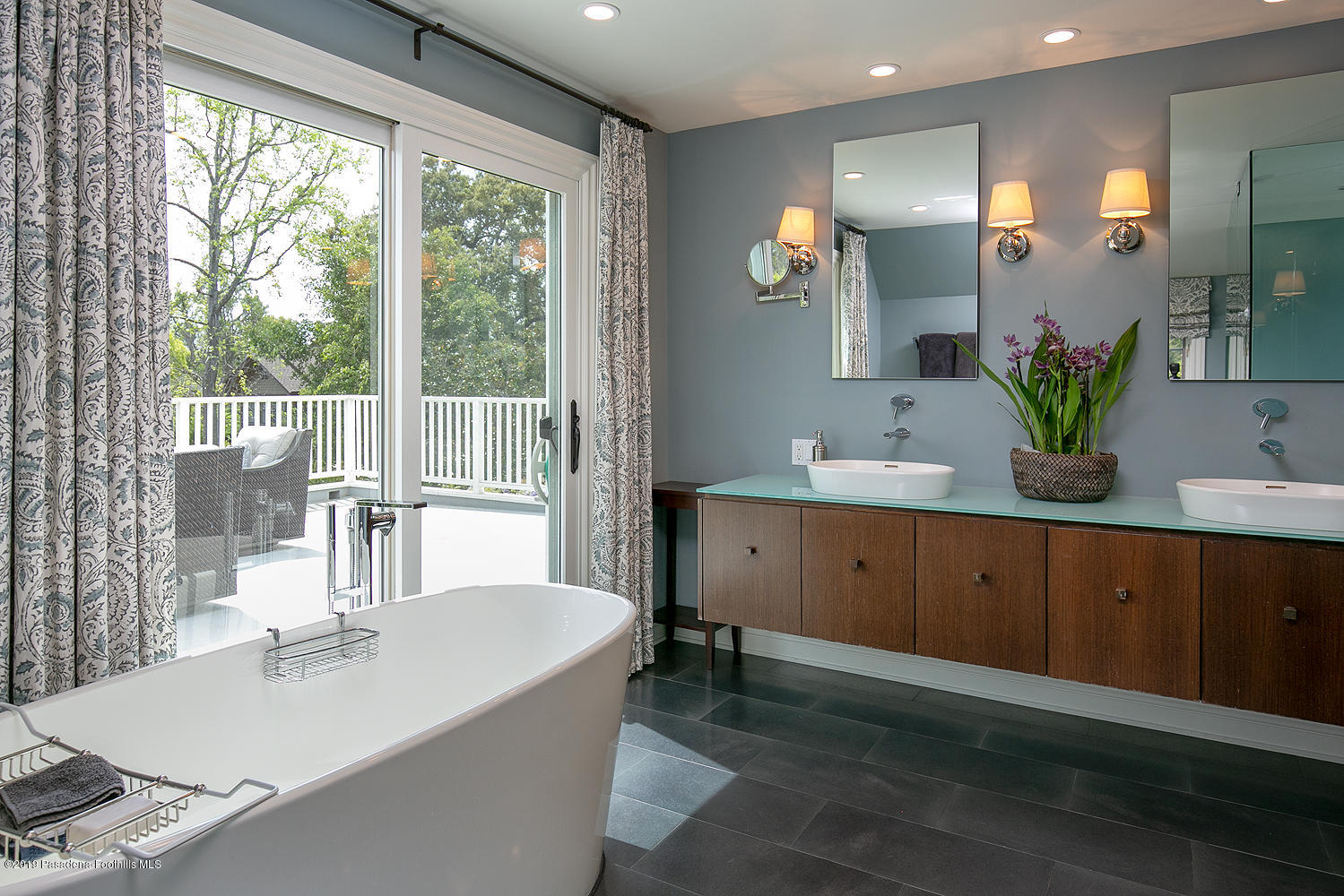 504 Arbor Street Pasadena, CA 91105 - Photo 28 of 46 a bathroom with a double vanity sink and a mirror