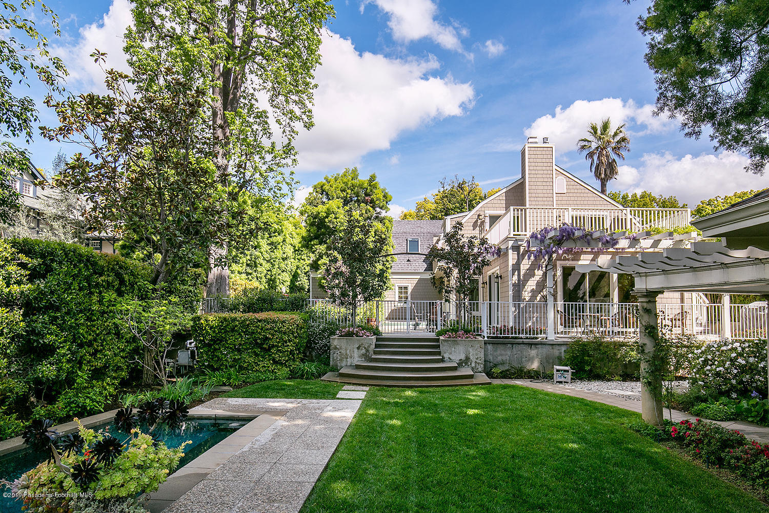 504 Arbor Street Pasadena, CA 91105 - Photo 40 of 46 a view of a house with a yard and a fountain