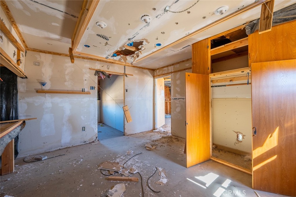 67722 Pole Line Road Twentynine Palms, CA 92277 - Photo 13 of 33 a view of a room with wooden walls