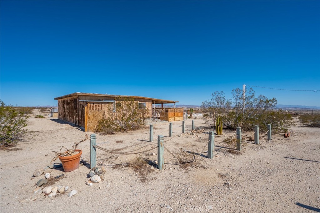 67722 Pole Line Road Twentynine Palms, CA 92277 - Photo 2 of 33 a view of a terrace with chairs