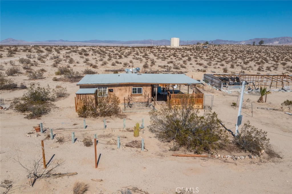 67722 Pole Line Road Twentynine Palms, CA 92277 - Photo 31 of 33 a view of a beach with a building in the background