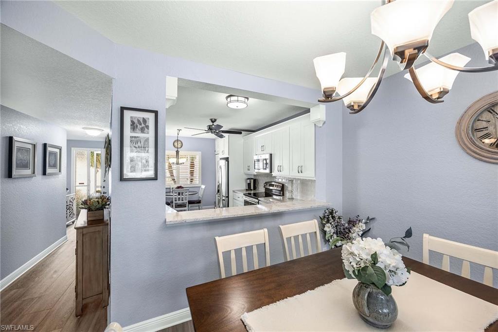 9022 Michael Circle, Unit 3 Naples, FL 34113 - Photo 12 of 29 a dining room with furniture