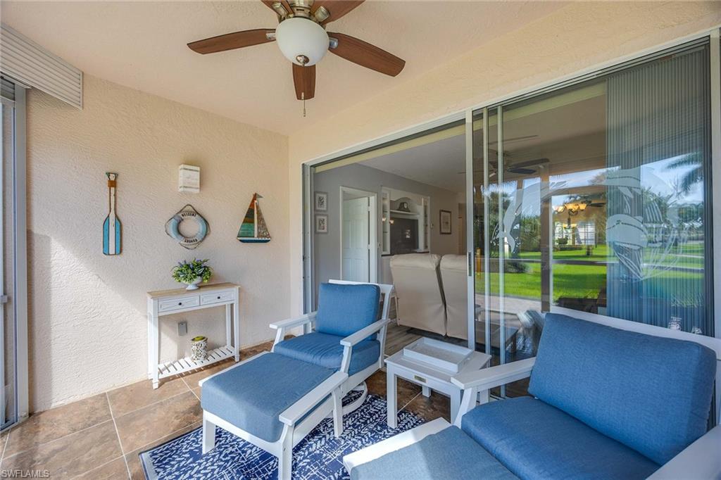 9022 Michael Circle, Unit 3 Naples, FL 34113 - Photo 24 of 29 a living room with furniture and a garden