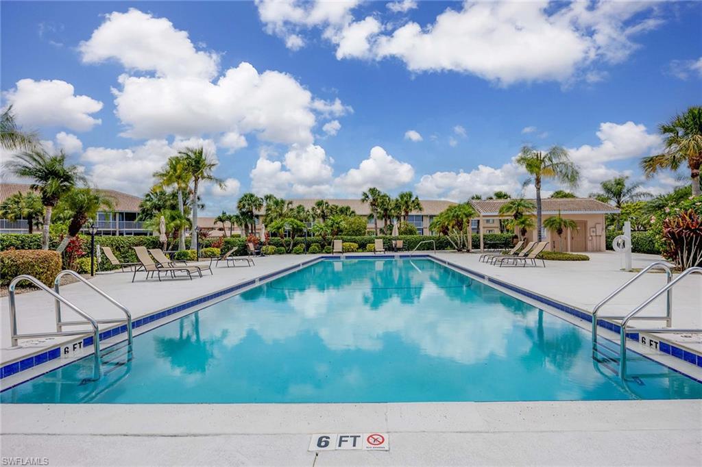 9022 Michael Circle, Unit 3 Naples, FL 34113 - Photo 29 of 29 a view of swimming pool with outdoor seating