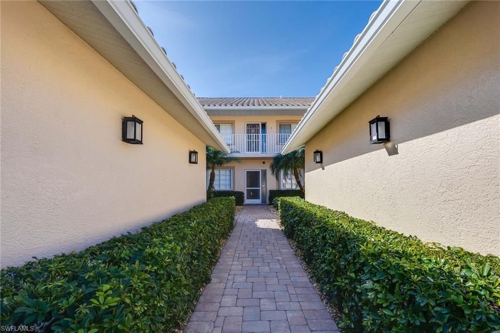 9022 Michael Circle, Unit 3 Naples, FL 34113 - Photo 3 of 29 a view of house with garden