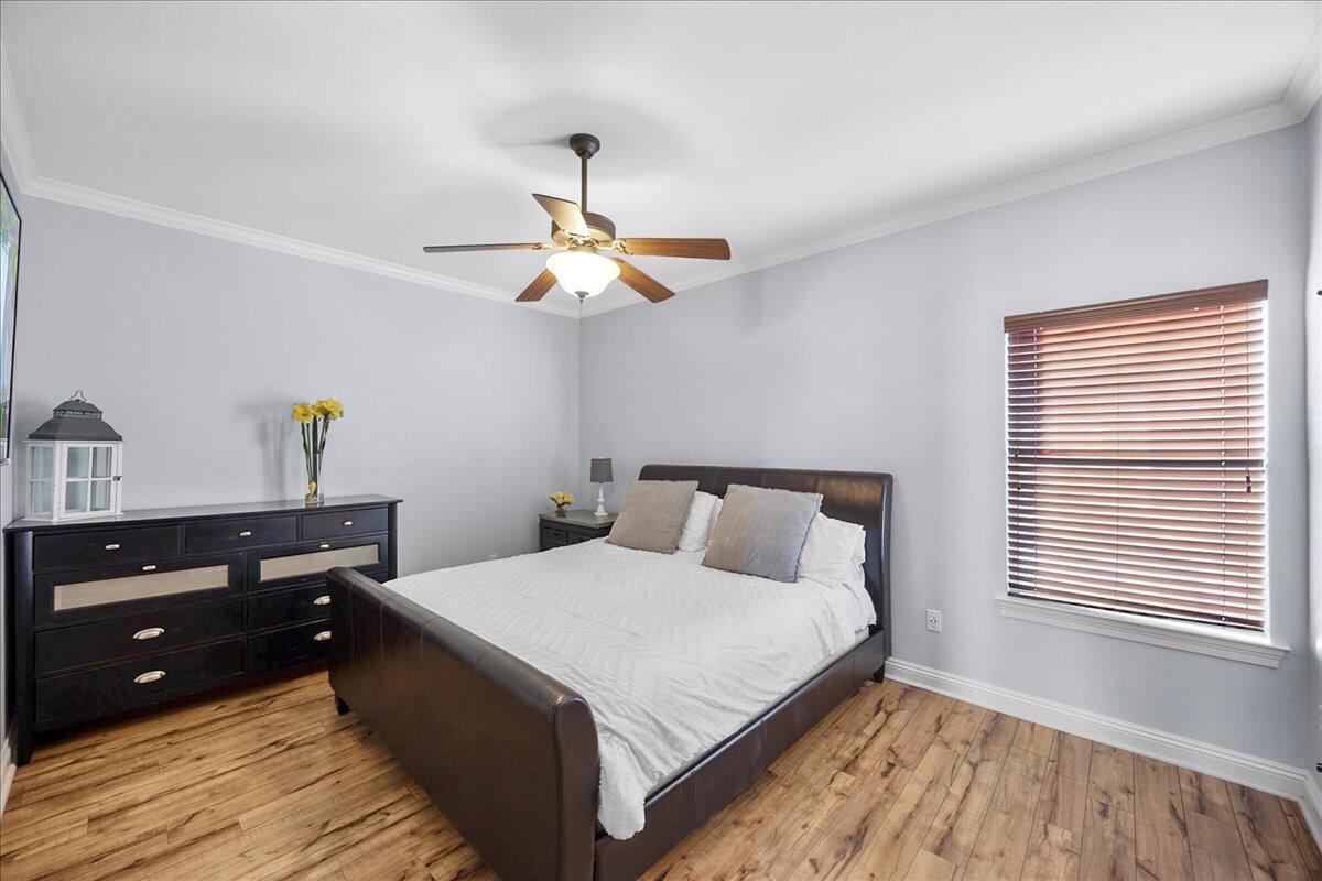 210 Grand Key Loop West Destin, FL 32541 - Photo 12 of 46 a bedroom with a bed and window