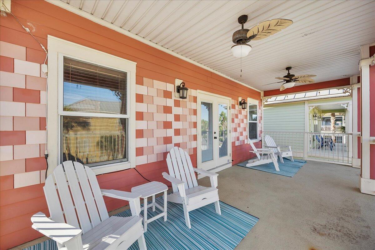 210 Grand Key Loop West Destin, FL 32541 - Photo 16 of 46 a view of a patio with a table and chairs