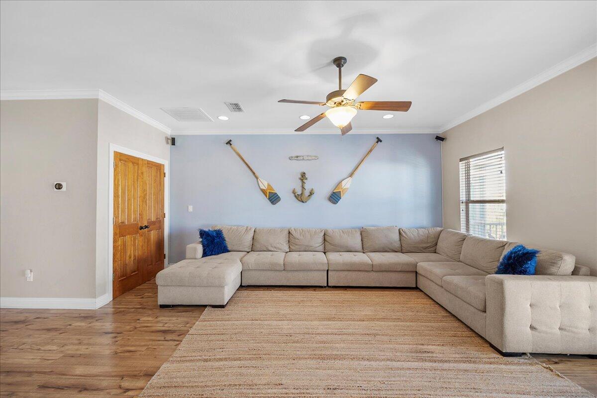 210 Grand Key Loop West Destin, FL 32541 - Photo 21 of 46 a living room with furniture and wooden floor