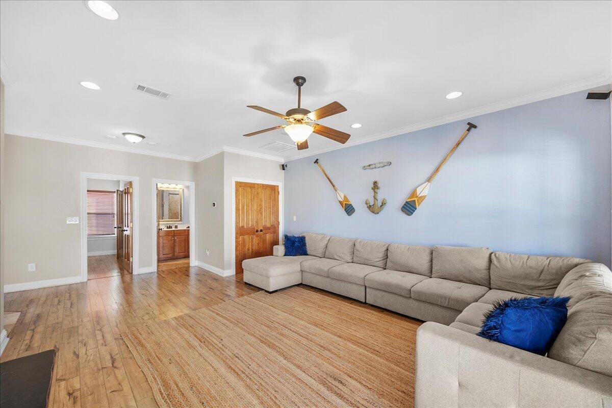 210 Grand Key Loop West Destin, FL 32541 - Photo 22 of 46 a living room with furniture and wooden floor