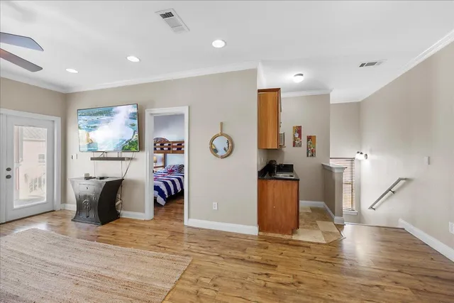 a view of a livingroom with furniture and a flat screen tv