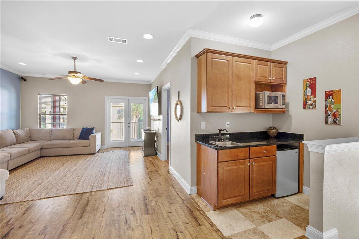 210 Grand Key Loop West Destin, FL 32541 - Photo 24 of 46 a kitchen with stainless steel appliances granite countertop a stove a sink dishwasher and a refrigerator