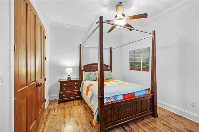 a bedroom with a bed next to a window