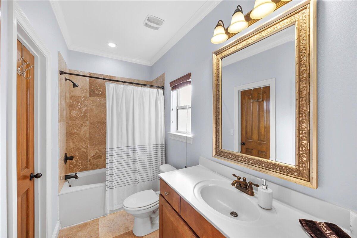 210 Grand Key Loop West Destin, FL 32541 - Photo 28 of 46 a bathroom with a sink a toilet and shower