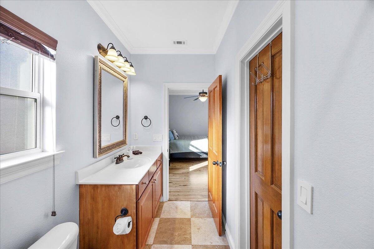 210 Grand Key Loop West Destin, FL 32541 - Photo 29 of 46 a bathroom with a sink a toilet and shower