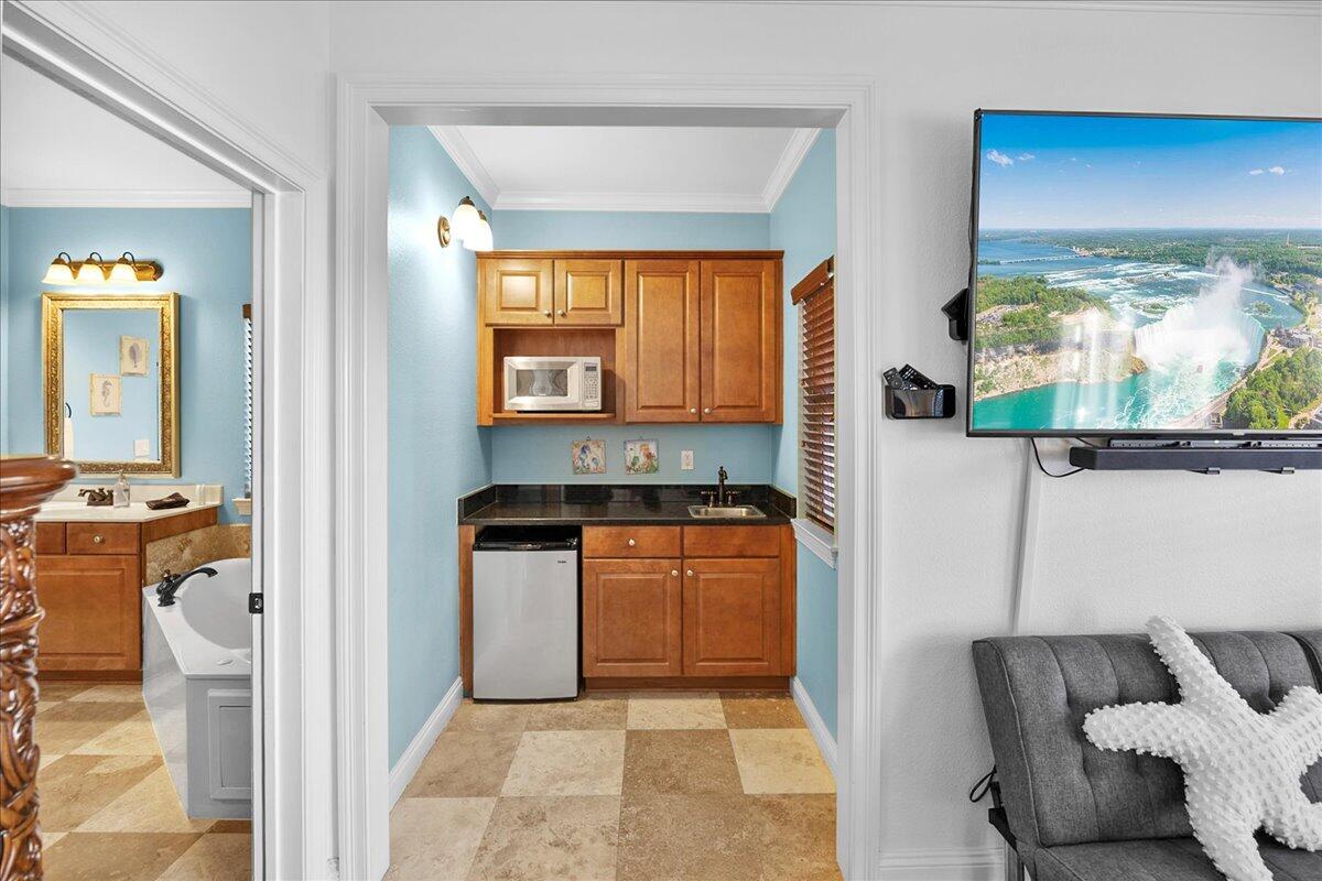 210 Grand Key Loop West Destin, FL 32541 - Photo 32 of 46 a kitchen with stainless steel appliances granite countertop a stove and a refrigerator