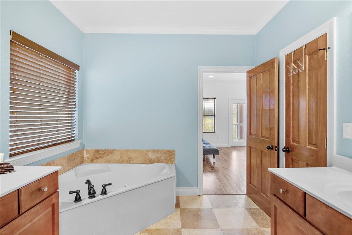 210 Grand Key Loop West Destin, FL 32541 - Photo 34 of 46 a bathroom with a bathtub and a sink