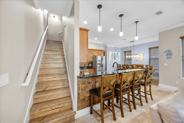a dining room with furniture and entryway
