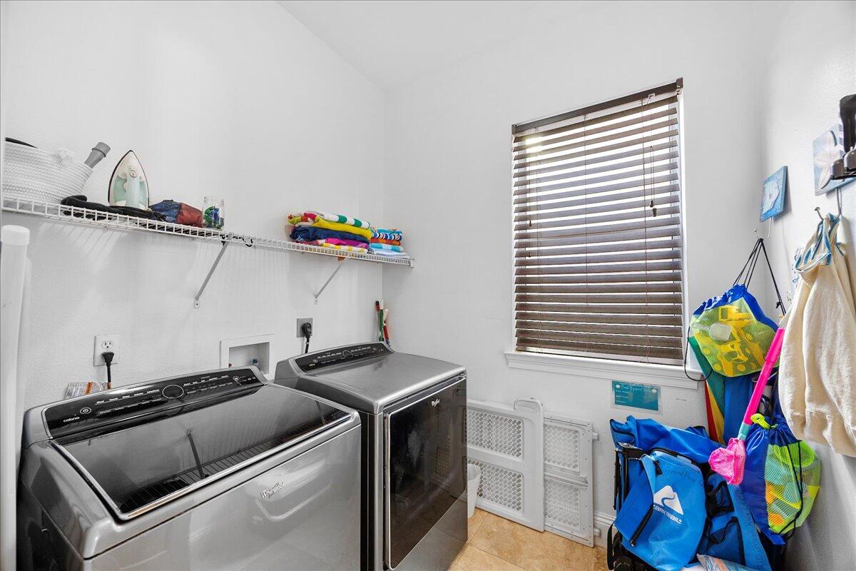 210 Grand Key Loop West Destin, FL 32541 - Photo 41 of 46 a utility room with dryer and washer