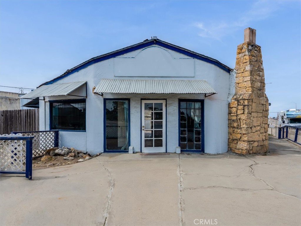 396 Pier Avenue Oceano, CA 93445 - Photo 1 of 24 a front view of a house with barbeque