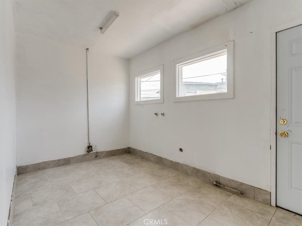 396 Pier Avenue Oceano, CA 93445 - Photo 17 of 24 a view of an empty room with a window