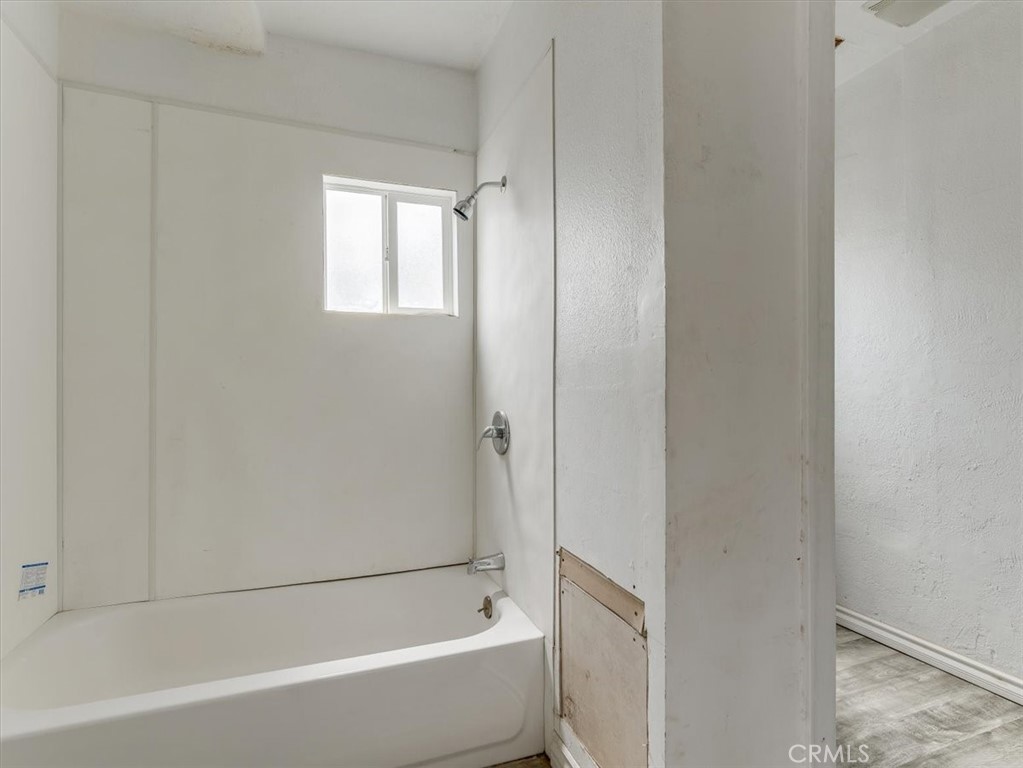 396 Pier Avenue Oceano, CA 93445 - Photo 20 of 24 a bathroom with a bathtub and a shower