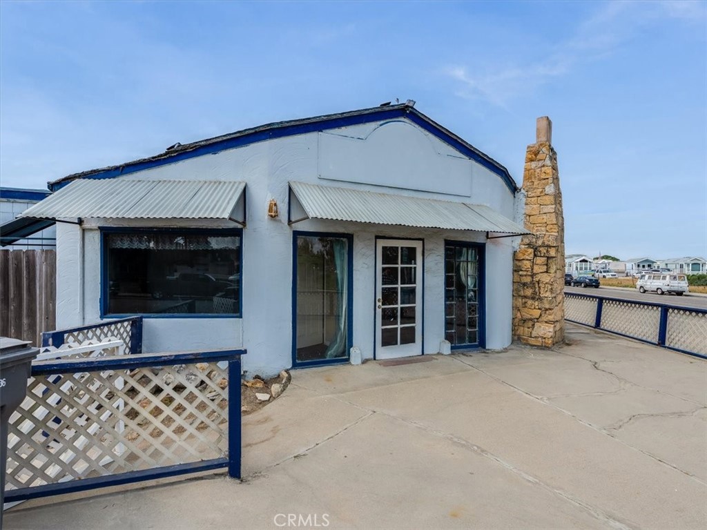 396 Pier Avenue Oceano, CA 93445 - Photo 2 of 24 a front view of a house with glass windows