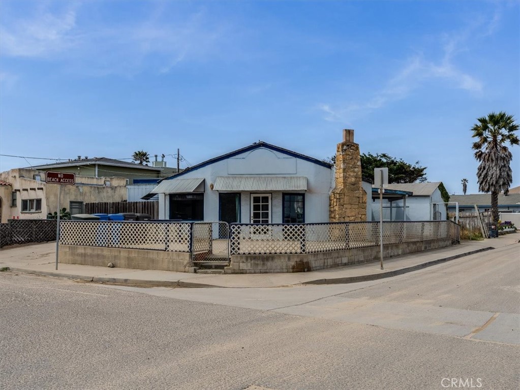 396 Pier Avenue Oceano, CA 93445 - Photo 3 of 24 a front view of a house with a porch