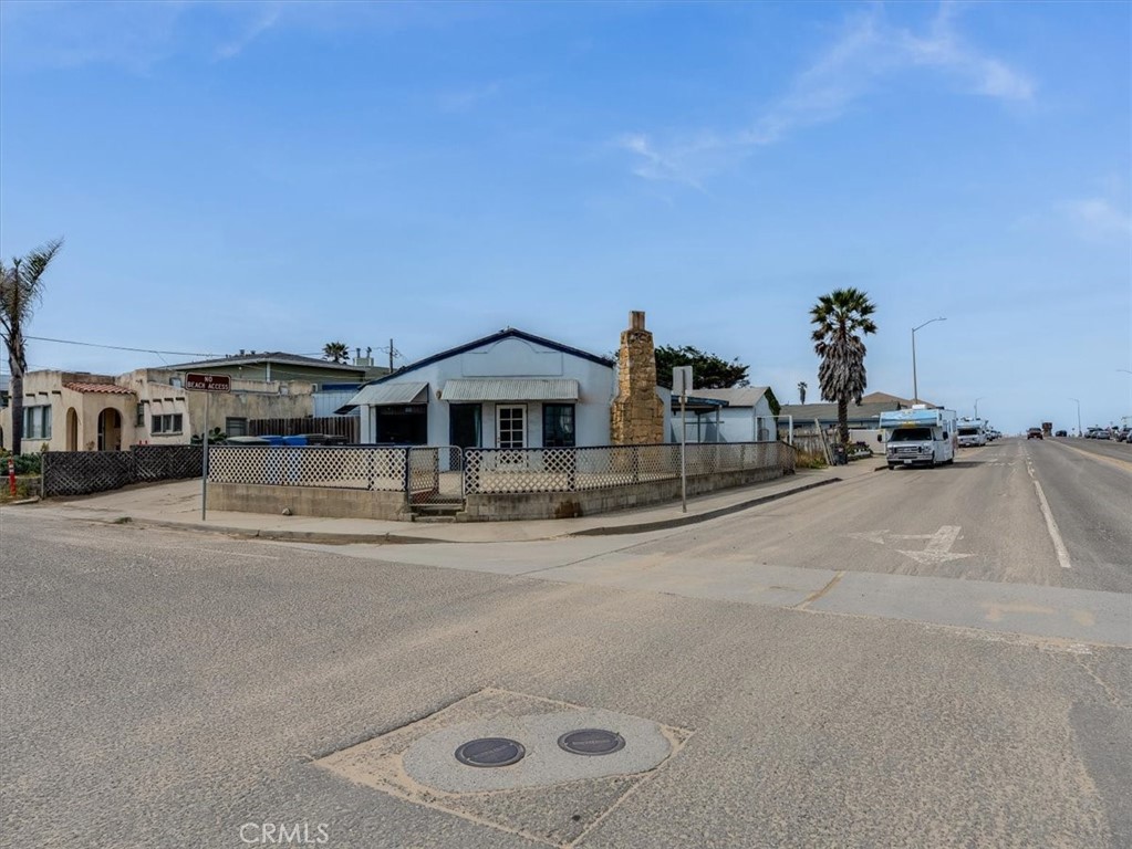 396 Pier Avenue Oceano, CA 93445 - Photo 4 of 24 a front view of a house with a yard