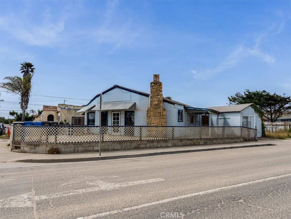 396 Pier Avenue Oceano, CA 93445 - Photo 5 of 24 a front view of a house with a street