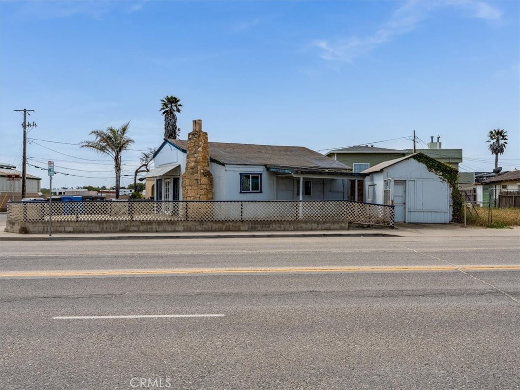 396 Pier Avenue Oceano, CA 93445 - Photo 7 of 24 a front view of a house with a garden